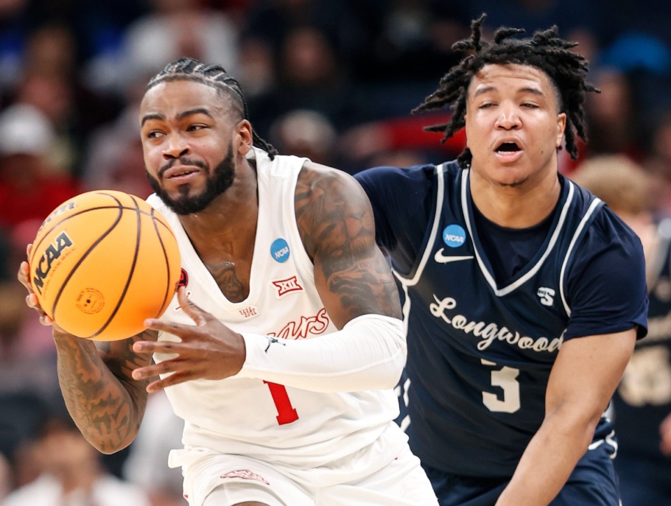 <strong>Houston guard Jamal Shead (left) grabs a loose ball in front of Longwood guard DA Houston (right) during the NCAA Tournament on Friday, March 22, 2024.</strong> (Mark Weber/The Daily Memphian)