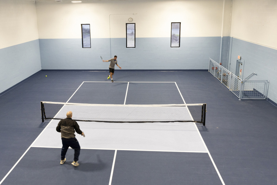 <strong>Two attendees play on one of the courts at Bluff City Pickleball, which opened inside a former Malco theater Saturday, March 23, at 2809 Bartlett Blvd.</strong> (Brad Vest/Special to The Daily Memphian)