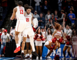 <strong>Houston teammates J'Wan Roberts (left) and Emanuel Sharp (right) celebrate an overtime victory over Texas A&amp;M in the NCAA Tournament on Sunday, March 24, 2024.</strong> (Mark Weber/The Daily Memphian)