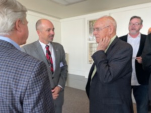 <strong>Terry Blue, center, new president and CEO of the Memphis Shelby County Airport Authority, speaks Tuesday, March 27, with Metcalf Crump, left, and Alex Wellford&nbsp;at Memphis Rotary Club meeting. Ned Canty is in the background.</strong> (Jane Roberts/The Daily Memphian)&nbsp;
