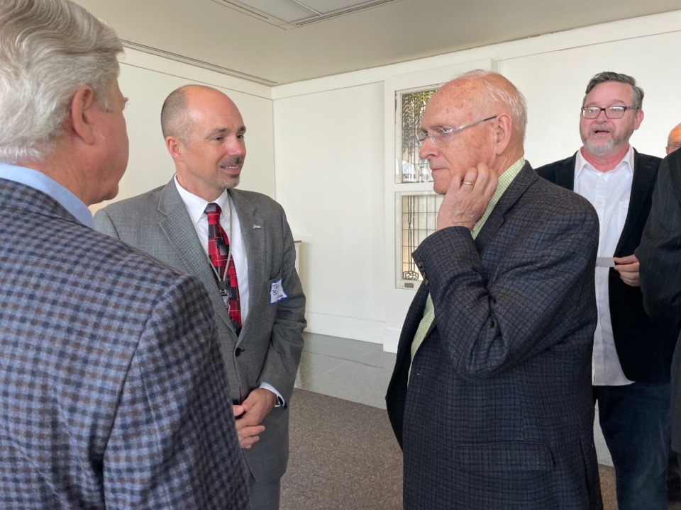<strong>Terry Blue (center), the new president and CEO of the Memphis Shelby County Airport Authority, speaks March 27 with Metcalf Crump (left) and Alex Wellford&nbsp;at a Memphis Rotary Club meeting. Ned Canty is in the background.</strong>&nbsp;(Jane Roberts/The Daily Memphian)&nbsp;