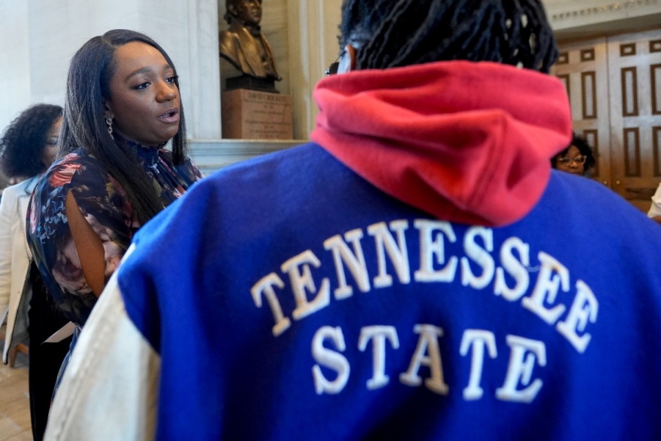 <strong>State Sen. London Lamar, D-Memphis, speaks to a Tennessee State University supporter outside the legislative chambers Thursday, March 28, 2024, in Nashville. The House voted to vacate the school's board of trustees.</strong> (George Walker IV/AP)