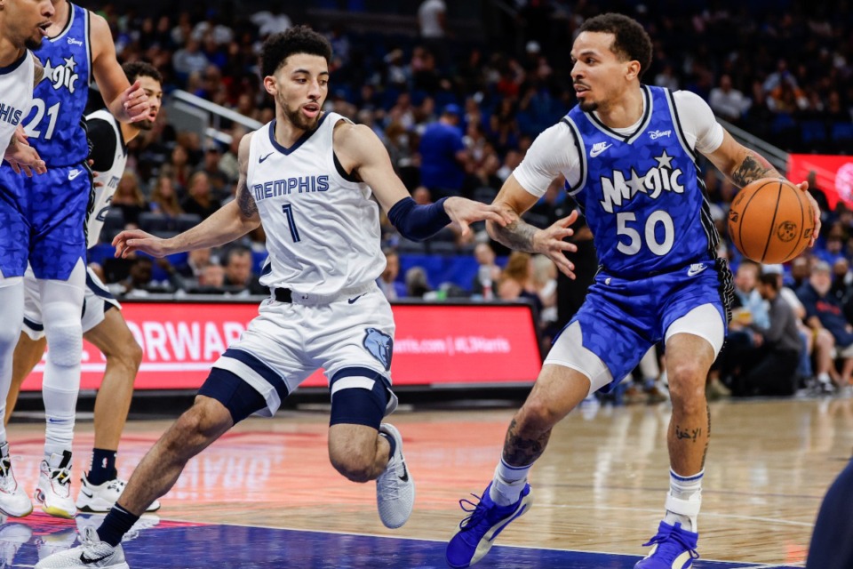 <strong>Memphis Grizzlies guard Scotty Pippen Jr. (1) defends against Orlando Magic guard Cole Anthony (50) during the first half of an NBA basketball game Saturday, March 30, 2024, in Orlando, Fla.</strong> (AP Photo/Kevin Kolczynski)