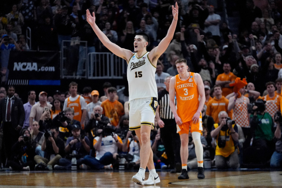 <strong>Purdue center Zach Edey (15) reacts near Tennessee guard Dalton Knecht (3) after the team defeated Tennessee in an Elite Eight college basketball game in the NCAA Tournament, Sunday, March 31, in Detroit.</strong> (Paul Sancya/AP Photo)