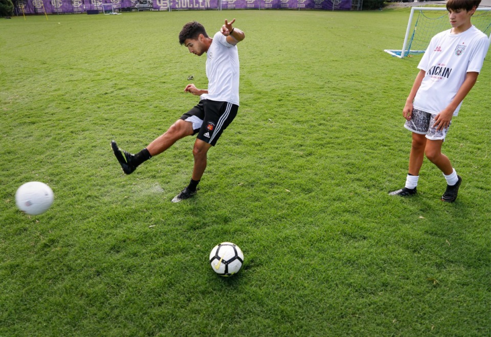 <strong>Former University of Memphis soccer player Hector Cantele (left) runs Clayton Somogyi (right) though drills on Thursday, July 23, 2020 at Christian Brothers High School.</strong> (Mark Weber/The Daily Memphian file)