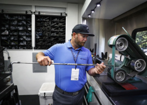 <strong>True Temper PGA club technician Justin Smith works on a new wedge on the company's touring truck during the WGC-FedEx St. Jude Invitational practice day at TPC Southwind Tuesday, July 23, 2019. True Temper, a local golf shaft company, plans to move its headquarters from Southwind to Downtown Memphis and rebrand itself as TRUE Sports.</strong> (Mark Weber/Daily Memphian)