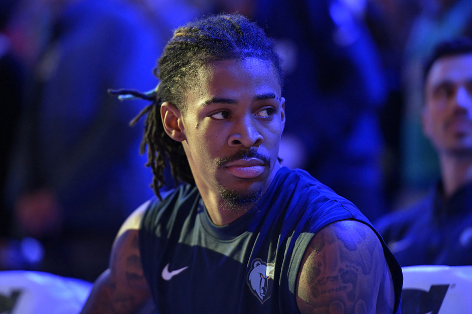 <strong>Memphis Grizzlies guard Ja Morant sits on the bench before an NBA basketball game against the San Antonio Spurs Jan. 2 in Memphis.</strong> (Brandon Dill/AP file)