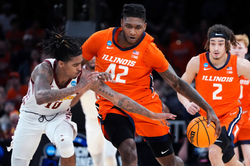 <strong>Iowa State guard Keshon Gilbert (10) tries to steal the ball from Illinois forward Dain Dainja (42) during the second half of the Sweet 16 college basketball game in the men's NCAA Tournament, Friday, March 29, 2024, in Boston.</strong> (AP Photo/Michael Dwyer)