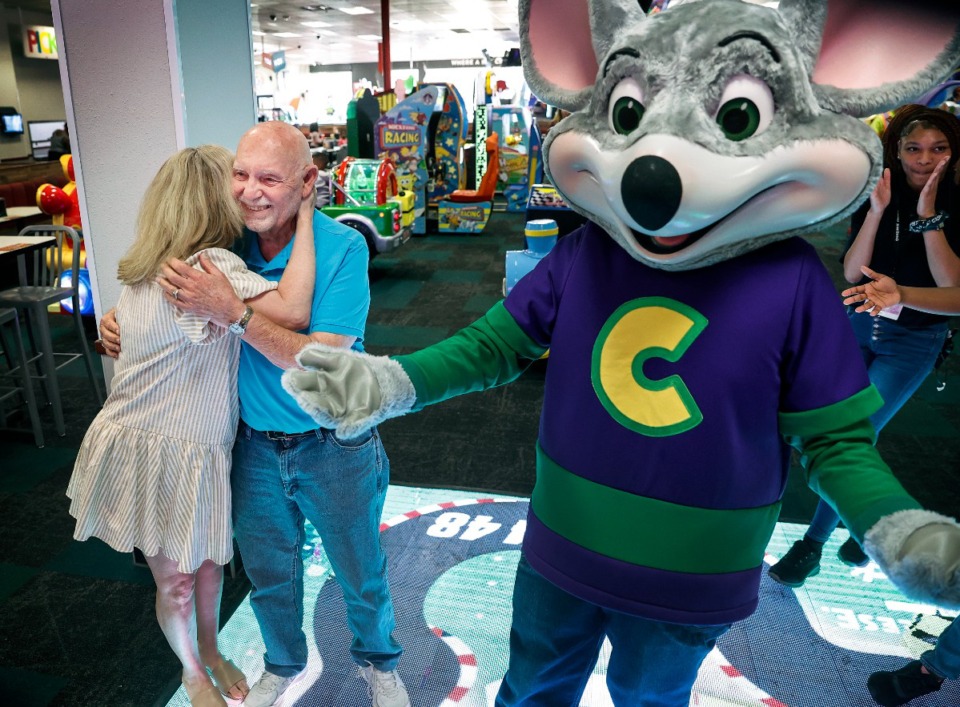 <strong>Harold Goldbransen (middle) receives a hug from his daughter Lori Williamson (left) while celebrating his 80th birthday at Chuck E Cheese on Thursday, April 4, 2024.</strong> (Mark Weber/The Daily Memphian)