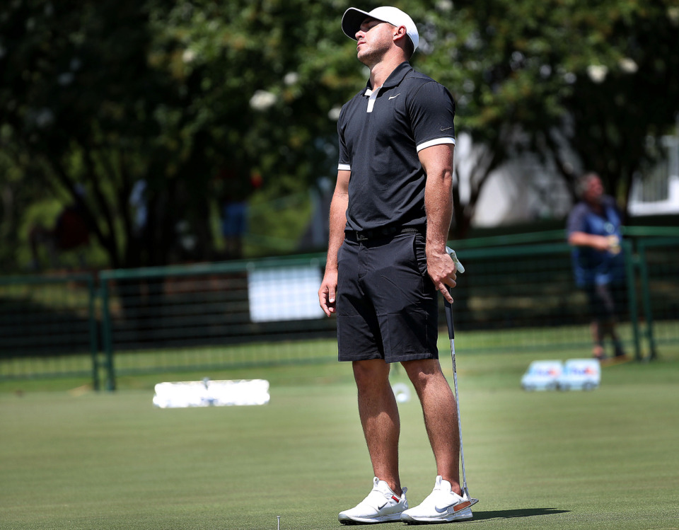 <strong>Brooks Koepka reacts to a missed putt on the practice green during a day of practice rounds at the WGC - FedEx St. Jude Invitational at TPC Southwind on July 24, 2019. Some of golf's biggest names were out Wednesday to get a feel for the course and conditions before the start of tournament play on Thursday.</strong> (Jim Weber/Daily Memphian)