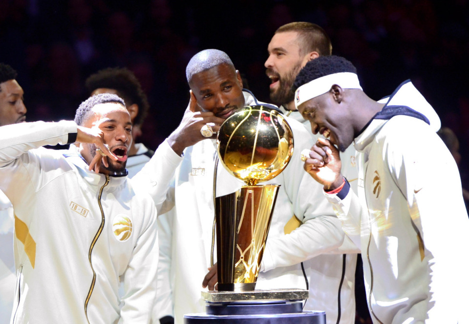 <strong>Toronto Raptors' Norman Powell, Serge Ibaka, Marc Gasol and Pascal Siakam, from left, stand with their rings behind the NBA Championship Trophy before playing the New Orleans Pelicans on Oct. 22, 2019. After the Raptors series winning game over Golden State, Gasol received a hug from his high school friend Jonnie West.</strong>&nbsp;(Frank Gunn/The Canadian Press via AP)