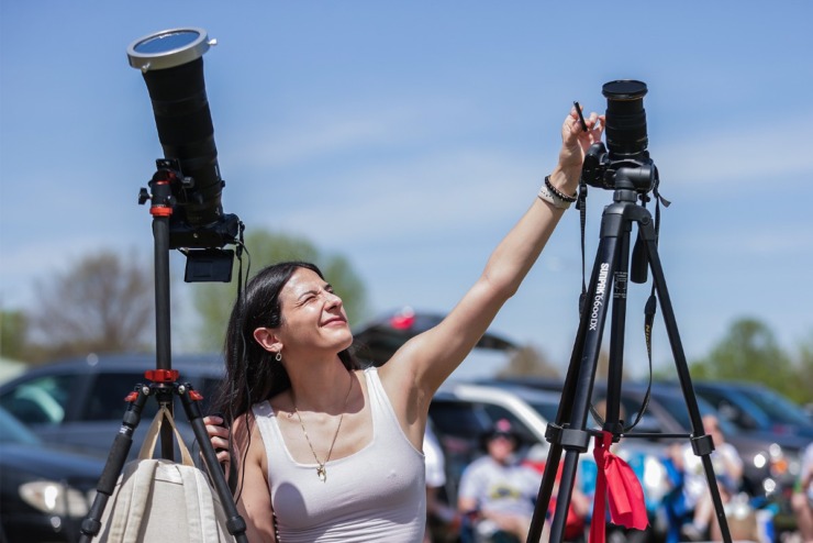 <strong>Photographer Taylor Kelsh-Adami, from St. Louis, lines up her shot during the solar eclipse in Sikeston, Missouri, April, 8, 2024.</strong> (Patrick Lantrip/The Daily Memphian)