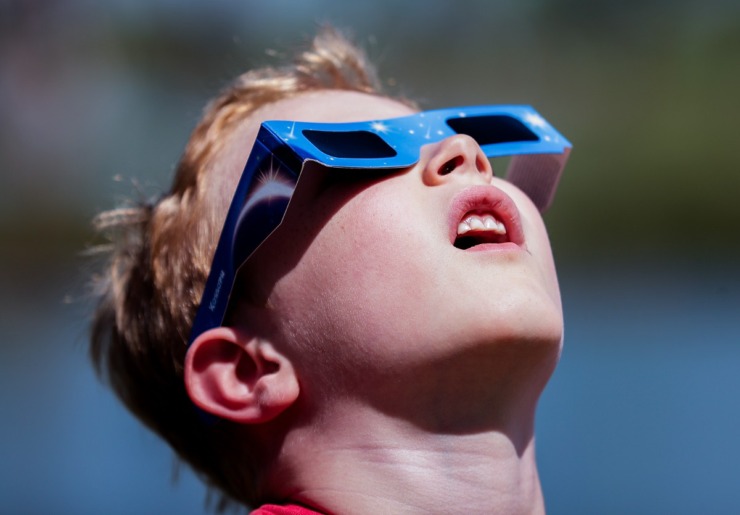 <strong>Samuel Brown from Jackson, Tennessee, looks at the solar eclipse in Sikeston, Missouri, April 8, 2024.</strong> (Patrick Lantrip/The Daily Memphian)