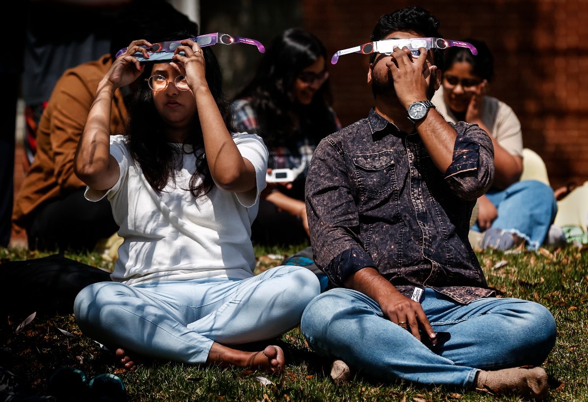 <strong>Onlookers watch the solar eclipse on Monday, April 8, 2024, at the University of Memphis. (</strong>Mark Weber/The Daily Memphian)