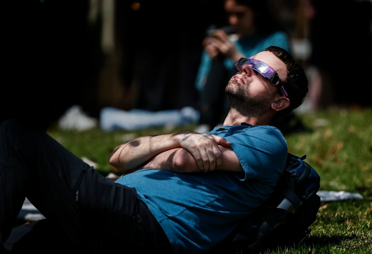 <strong>Onlookers watch the solar eclipse on Monday, April 8, 2024, at the University of Memphis.</strong> (Mark Weber/The Daily Memphian)