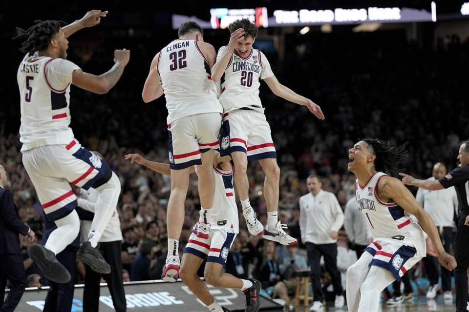<strong>UConn celebrates their win against Purdue in the NCAA college Final Four championship basketball game, Monday, April 8, 2024, in Glendale, Ariz.</strong> (David J. Phillip/AP Photo)