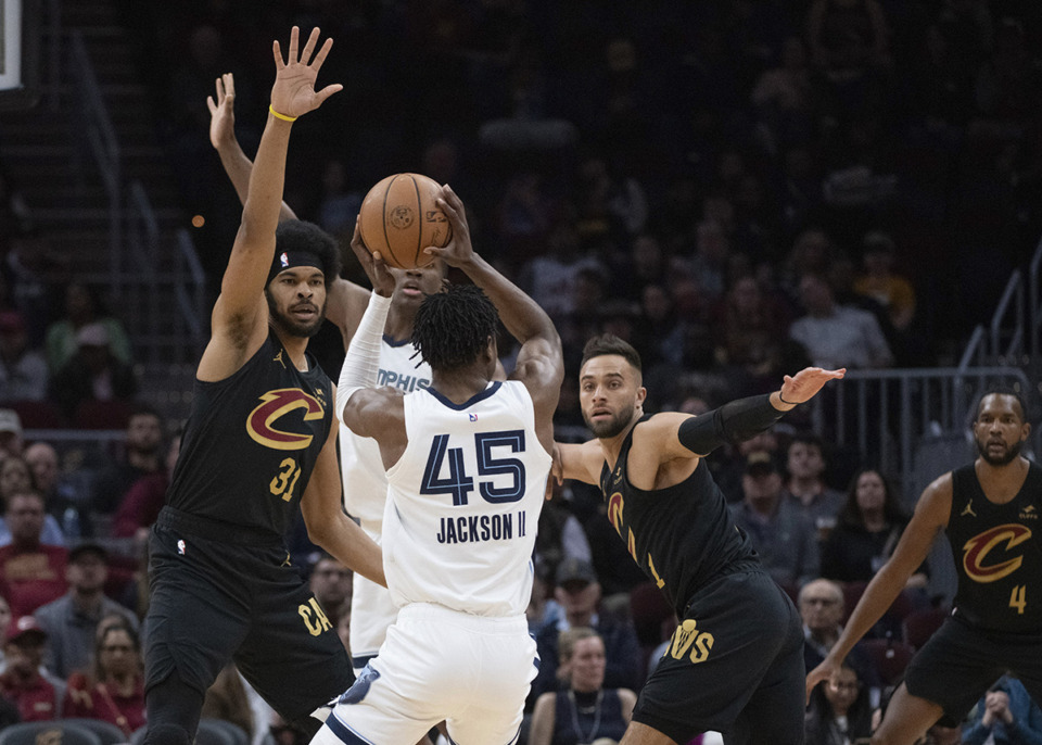 <strong>Memphis Grizzlies' GG Jackson (45) attempts a shot as Cleveland Cavaliers' Jarrett Allen (31) defends and the Cavaliers' Max Strus (1) looks on during the first half of an NBA basketball game in Cleveland, Wednesday, April 10.</strong> (Phil Long/AP)