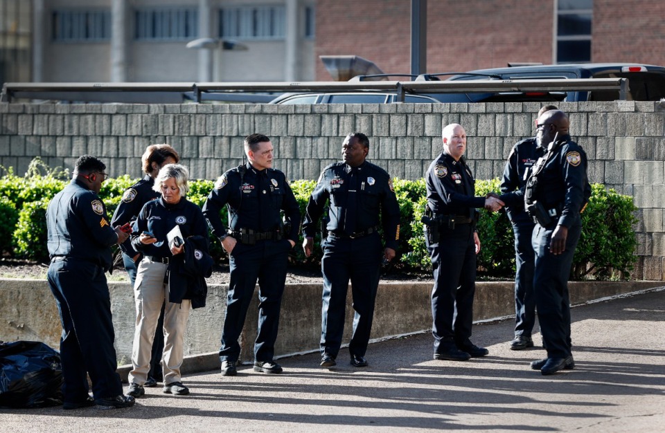 <strong>Memphis Police Officers wait outside Regional One Health on Friday, April 12, 2024, after an officer was killed earlier that morning.</strong> (Mark Weber/The Daily Memphian)