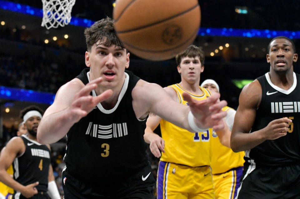 <strong>Memphis Grizzlies forward Jake LaRavia (3) reaches for the ball during the game against the Los Angeles Lakers on Friday, April 12, 2024.</strong> (Brandon Dill/AP)