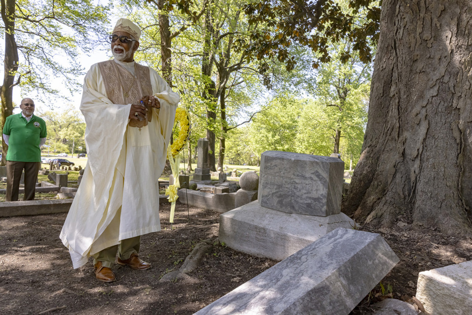 <strong>Dr. L. LaSimba Gray blesses final resting place of Dr. Georgia Patton-Washington, the first black woman licensed to practice medicine in Tennessee, after a wreath-laying ceremony at Zion Christian Cemetery, one of the oldest black cemeteries in Tennessee on Saturday, April 13, 2024.</strong> (Ziggy Mack/Special to The Daily Memphian)
