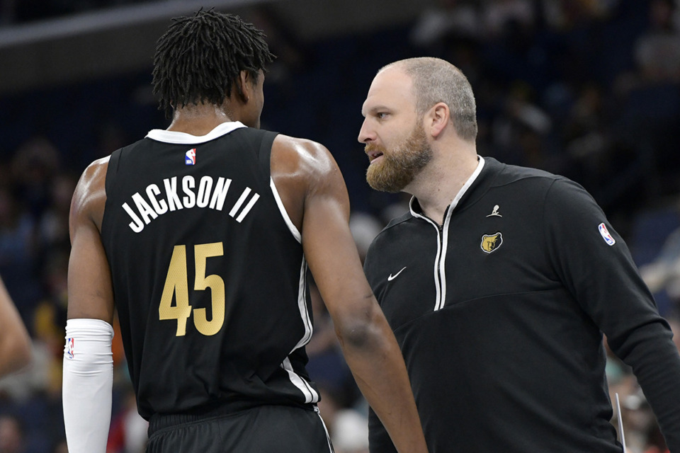 <strong>Memphis Grizzlies head coach Taylor Jenkins, right, talks with forward GG Jackson II (45) in the first half of an NBA basketball game against the Denver Nuggets, Sunday, April 14, in Memphis.</strong> (Brandon Dill/AP Photo)