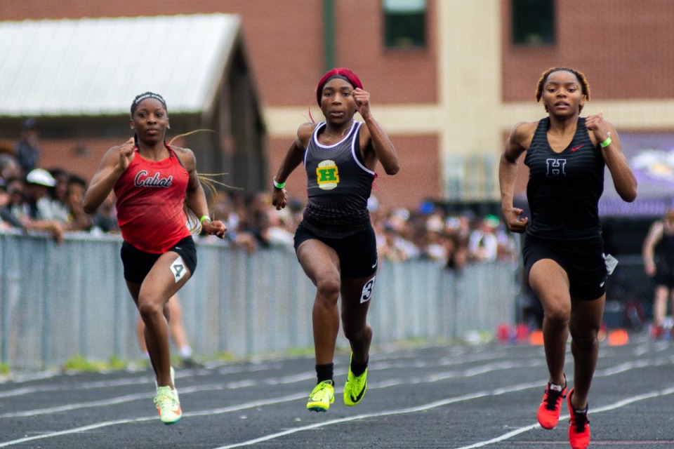 <strong>Karlisa Mungen (right) narrowly beats Central's Kia Dunn (middle) in the Girls 100m; with Cabot's Samantha Taylor (left) not too far behind. Saturday, April 15, 2023.</strong> (Joshua White/Special to The Daily Memphian file)