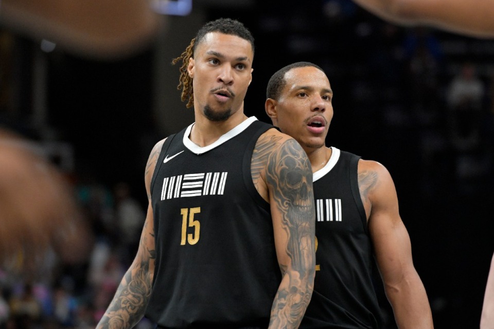 <strong>Memphis Grizzlies forward Brandon Clarke (15) and guard Desmond Bane stand on the court in the second half of an NBA basketball game against the Los Angeles Lakers Wednesday, March 27, in Memphis.</strong> (Brandon Dill/AP Photo file)