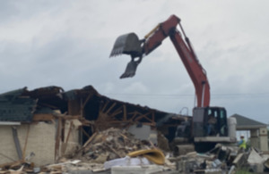 <strong>A crane performs the demolition of the Relax Inn at 3645 Canada Road in Lakeland&nbsp;April 17, 2024.</strong> (Michael Waddell/Special to The Daily Memphian)