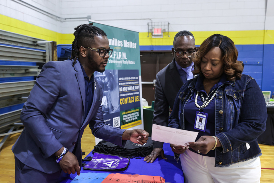 <strong>Darrin Moore with MLGW talks with Memphis City Council member Jana Swearengen-Washington at a expungement clinic and job fair she co-hosted at McFarland Community Center April 20.</strong> (Patrick Lantrip/The Daily Memphian)
