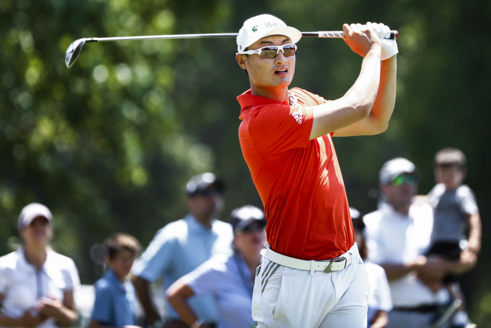 <strong>PGA golfer Haotong Li watches his tee shot on the second hole during first-round action at the WGC-FedEx St. Jude Invitational at TPC Southwind, Thursday, July 25, 2019.</strong> (Mark Weber/Daily Memphian)