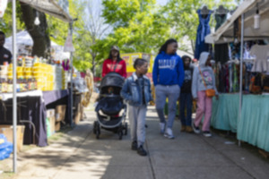 <strong>The Hicks family (back center left, Tyeisha Hicks; back center right Terrance Hicks) peruses the many vendors at Africa in April at Robert Church Park in Downtown Memphis Sunday, April 21.</strong> (Ziggy Mack/Special to The Daily Memphian)
