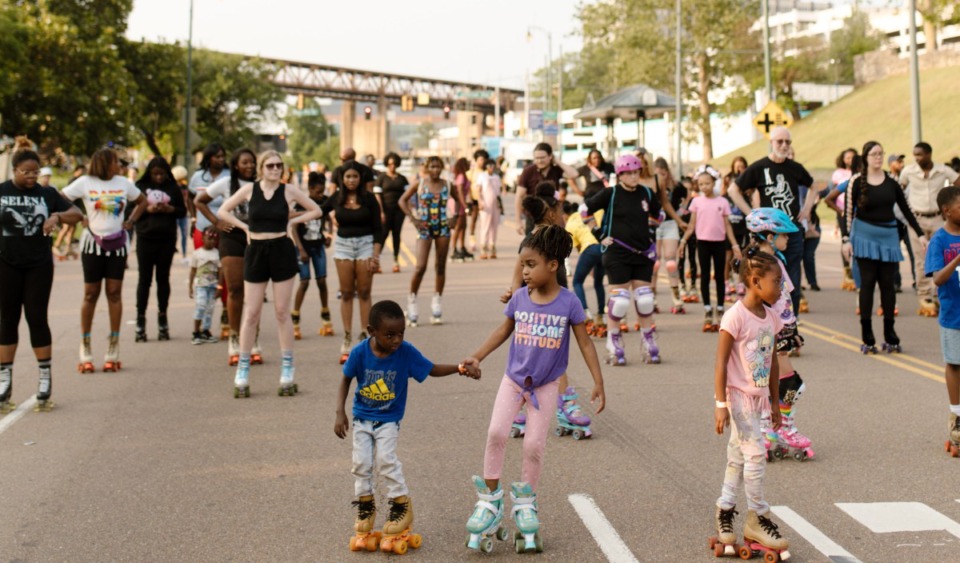 <strong>Dozens of local residents gather on Riverside Drive for the Sunset Skate event.</strong> (Courtesy Madeline Rose)