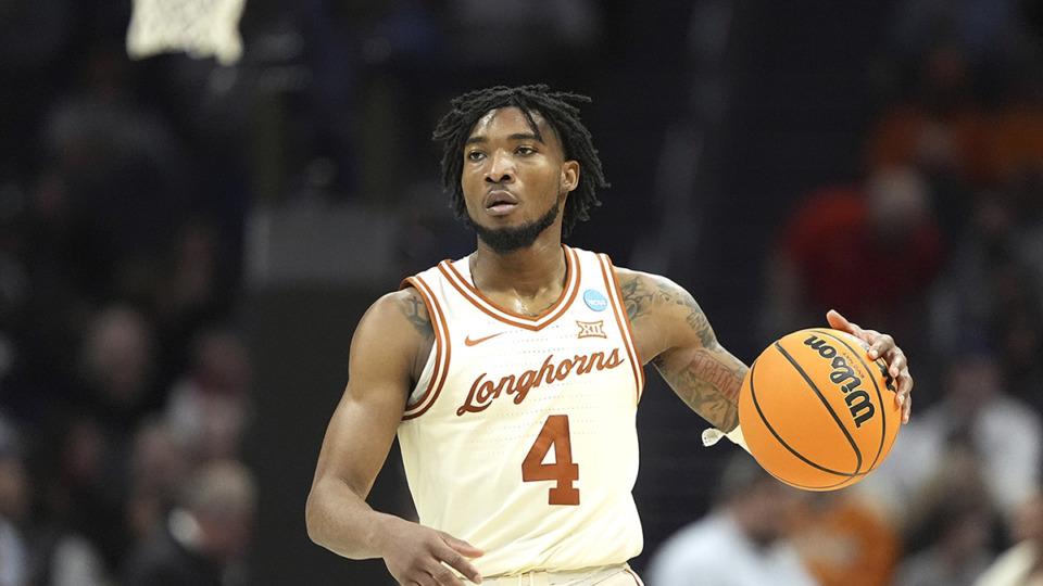 <strong>Texas guard Tyrese Hunter brings the ball down court against Colorado State during the second half of a first-round college basketball game in the NCAA Tournament March 21 in Charlotte, N.C.</strong> (Chris Carlson/AP Photo file)