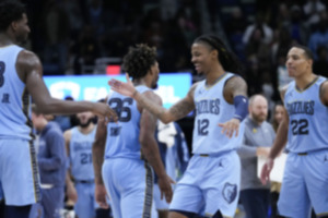 <strong>Memphis Grizzlies guard Ja Morant (12) celebrates after his slam dunk in the final seconds of overtime during an NBA basketball game against the New Orleans Pelicans in New Orleans Dec. 26, 2023. The Grizzlies won 116-115.</strong> (Gerald Herbert/AP Photo file)