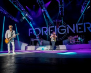 <strong>Foreigner with founder and lead guitarist Mick Jones, keyboardist Michael Bluestein, lead vocalist Kelly Hansen and drummer Chris Frazier performs at the Blue Hills Bank Pavilion, Wednesday, June 20, 2018, in Boston.</strong> (Robert E. Klein Invision/AP)