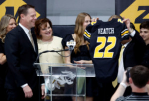 <strong>Laird Veatch, left, Missouri's new athletic director, smiles as Mun Choi, right, president of the University of Missouri System and chancellor of the University of Missouri, holds a jersey with Veatch's name on it Friday, April 26, 2024, in Columbia, Mo.</strong> (Christine Tannous/St. Louis Post-Dispatch via AP)