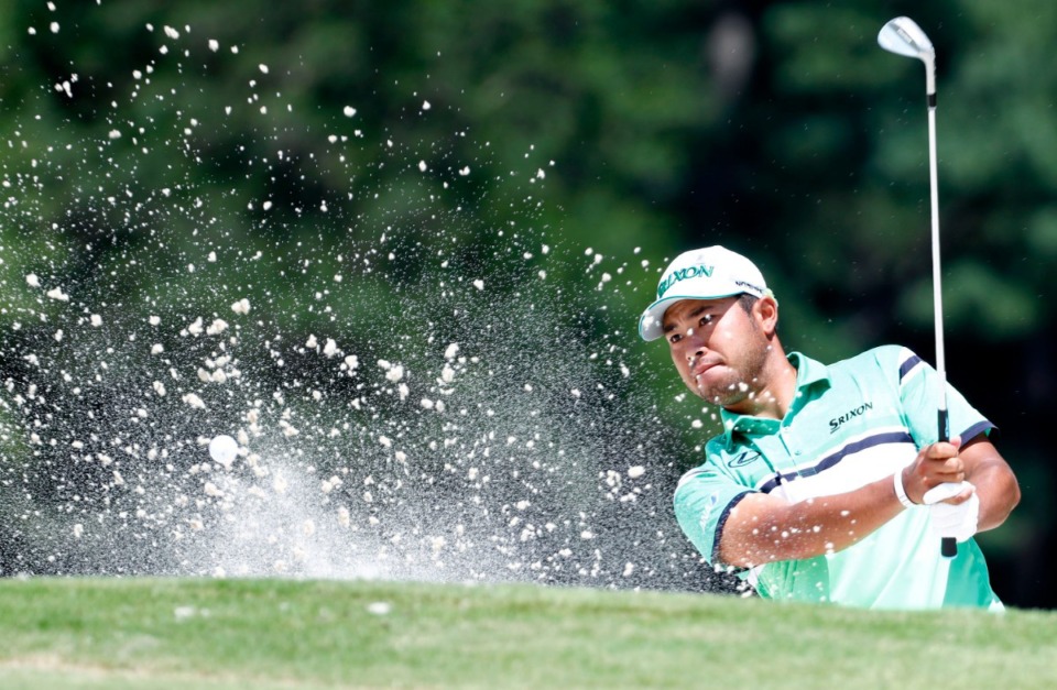<strong>Hideki Matsuyama blasts the ball out of the bunker on the 16th hole during the second round of the WGC-FedEx St. Jude Invitational on Friday, July 26, 2019. Matsuyama, who's No. 32 in the World Golf Rankings, is "one the most popular Japanese athletes in all of sports," says golf writer Rex Kuramoto. &nbsp;</strong> (Houston Cofield/Special to The Daily Memphian)