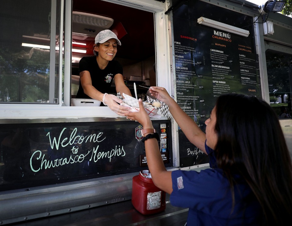 <strong>Maureen Diaz with Churrasco Memphis serves local medical students a free lunch courtesy of the Memphis Medical District Collaborative on Friday, July 26, 2019, at Health Sciences Park.</strong> (Patrick Lantrip/Daily Memphian)
