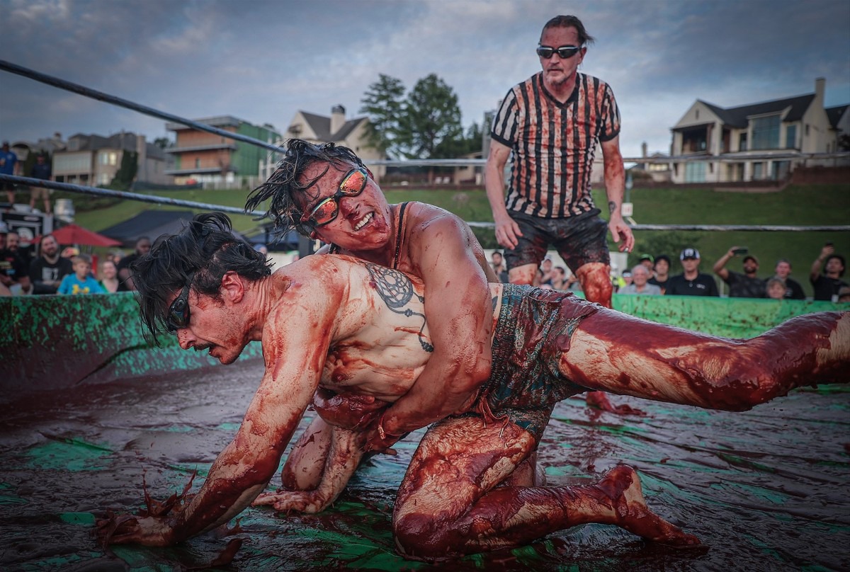 <strong>Hung Nguyen and Chris Coles grappled in the World Championship Barbecue Cooking Contest&rsquo;s Sauce Wrestling event on May 17, 2023.</strong> (Patrick Lantrip/The Daily Memphian file)