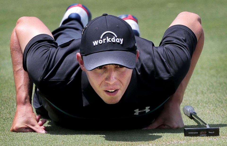 <strong>Matthew Fitzpatrick sights a putt on the seventh green during the second round of tournament play at the WGC-FedEx St. Jude Invitational at TPC Southwind on July 26, 2019. For much of the day the leaderboard was up for grabs, with 10 golfers within 3 strokes of the leader.</strong> (Jim Weber/Daily Memphian)