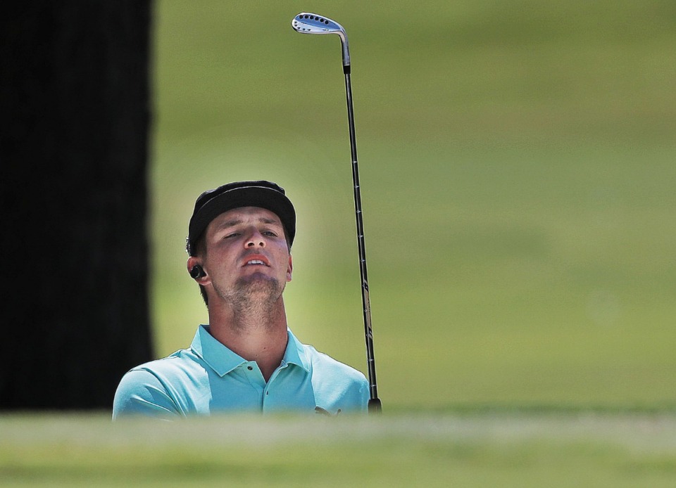 <strong>Bryson DeChambeau sights a chip in the practice area before the second round of tournament play at the WGC-FedEx St. Jude Invitational at TPC Southwind on July 26, 2019.</strong> (Jim Weber/Daily Memphian)