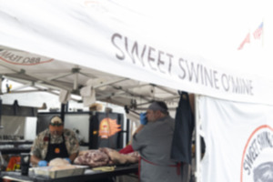 <strong>Team members from Sweet Swine O&rsquo;Mine work on their meats during the Memphis in May World Championship Barbecue Cooking Contest at Tom Lee Park in 2023.</strong> (Brad Vest/Special to The Daily Memphian)