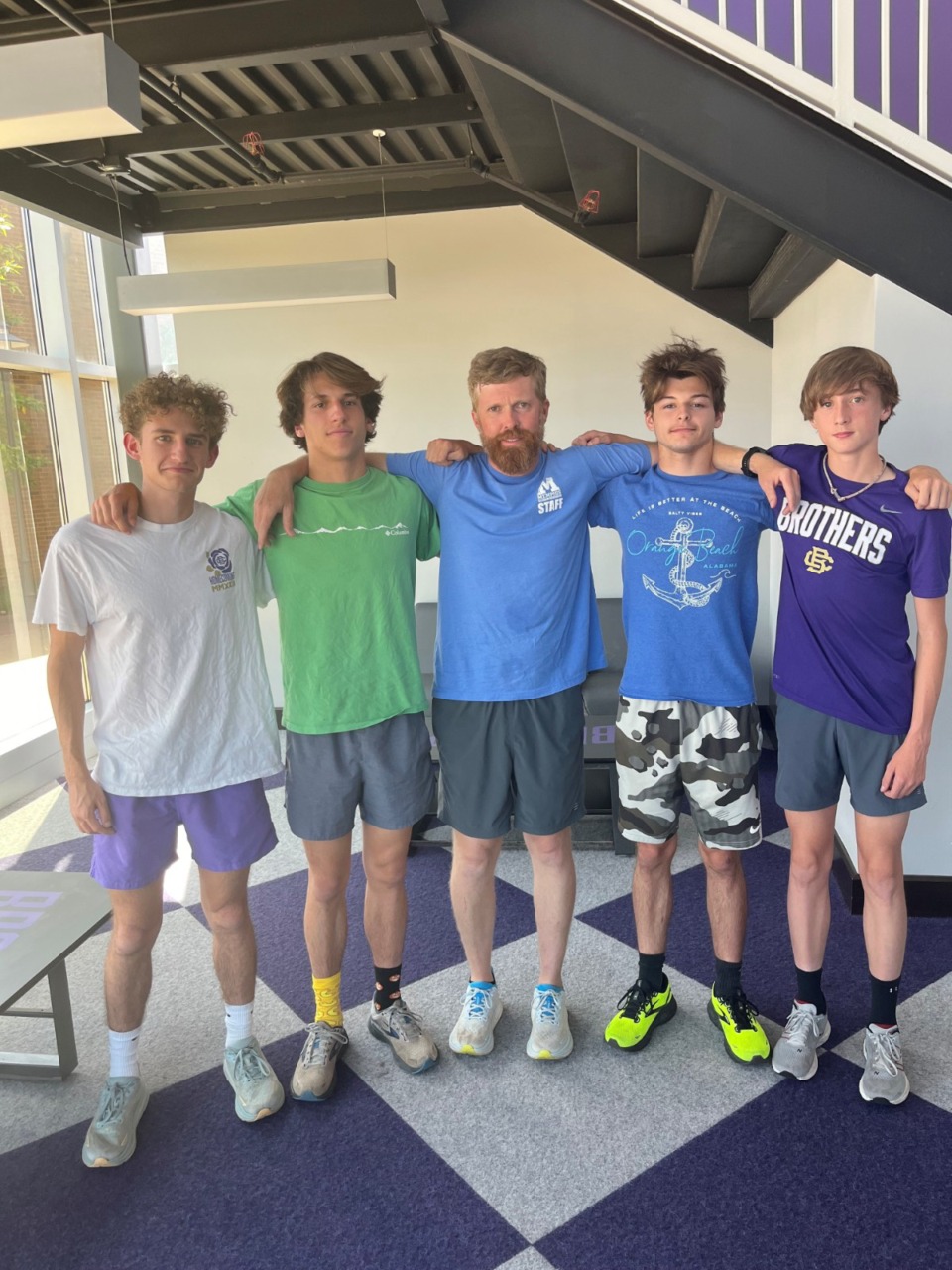 <strong>CBHS 3,200 relay team members Kaleb Smith (from left), Joe Edwards, Chaz Jones and Noah Mullenix with coach Nick Dwyer (middle).</strong> (John Varlas/The Daily Memphian)