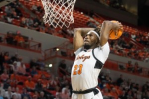 <strong>Tyreek Smith (23) goes up for a dunk while playing for Oklahoma State on Feb. 27, 2023.</strong>&nbsp;<strong>Smith played last season at SMU and announced Thursday, May 2 that he has committed to play next season for the Memphis Tigers.</strong> (Sue Ogrocki/AP file)