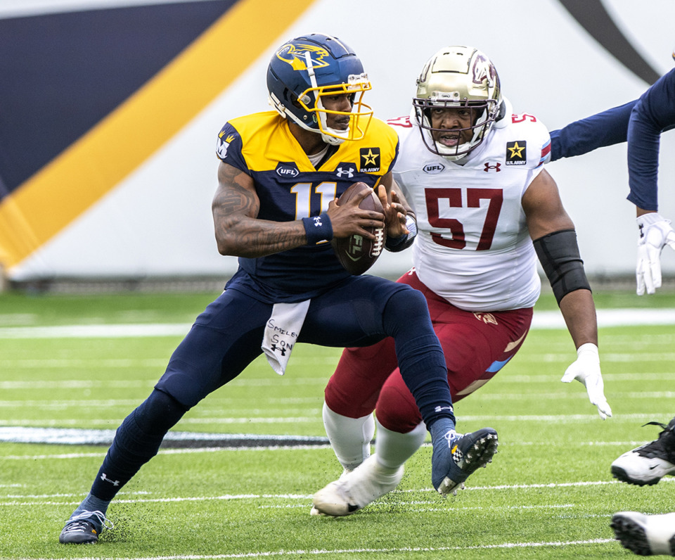 <strong>Memphis Showboats quarterback Troy Williams scrambles to get away from the Michigan Panthers defensive end Breeland Speaks at Simmons Bank Liberty Stadium April 28.</strong> (Greg Campbell/Special to The Daily Memphian)