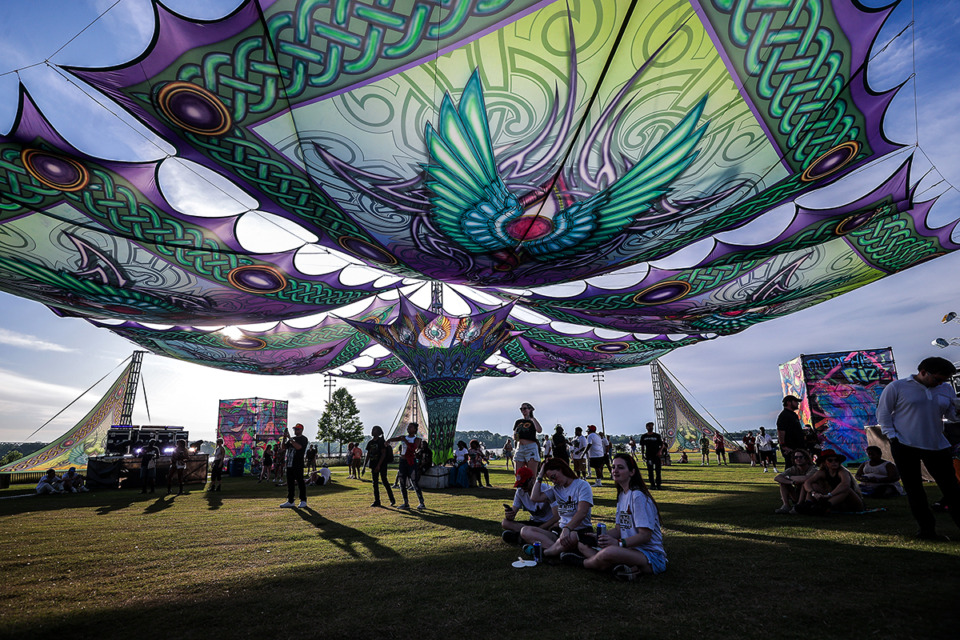 <strong>Fans sit under the tapestry at Whateverland at the inaugural Riverbeat Festival May 4, 2024.</strong> (Patrick Lantrip/The Daily Memphian)