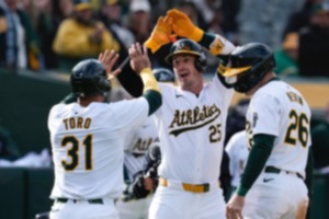 <strong>Oakland Athletics' Brent Rooker (25) celebrates with Abraham Toro (31) and Tyler Nevin (26) after hitting a three-run home run against the Miami Marlins during the third inning of a baseball game Saturday, May 4, 2024, in Oakland, Calif.</strong> (AP Photo/Godofredo A. V&aacute;squez)