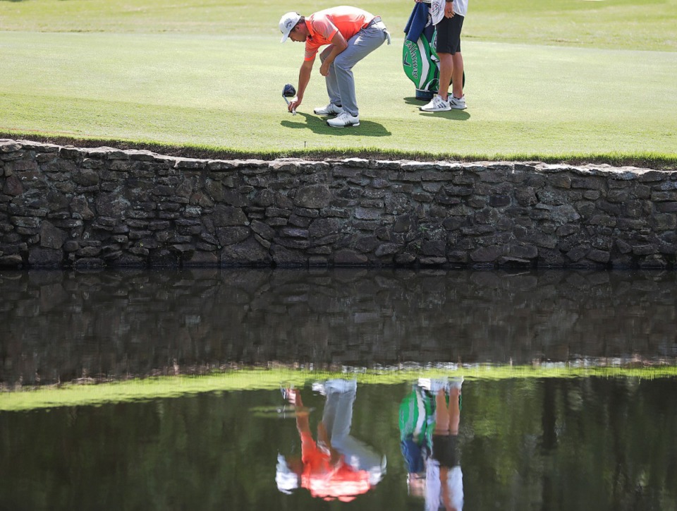 <strong>Xander Schauffele makes a drop on the fourth green after hitting into the water during the second round of the WGC-FedEx St. Jude Invitational July 26, 2019, at TPC Southwind.</strong> (Jim Weber/Daily Memphian)