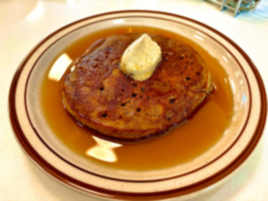 <strong>Kinfolk&rsquo;s griddle cakes are thick, fluffy and gluten-free &mdash; made with Anson Mills toasted oat flour. They&rsquo;re topped with maple syrup and with a special compound butter.</strong> (Joshua Carlucci/Special to The Daily Memphian)