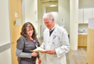 <strong>Dr. Scott Morris talks with a nurse at Church Health.</strong> (Courtesy Church Health)